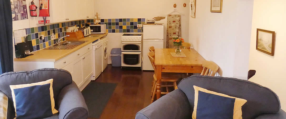 Open plan lounge, dining area and kitchen in The Hayloft holiday cottage