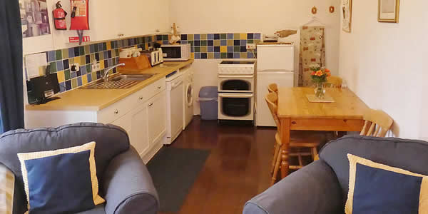 Open plan lounge, dining area and kitchen in The Hayloft